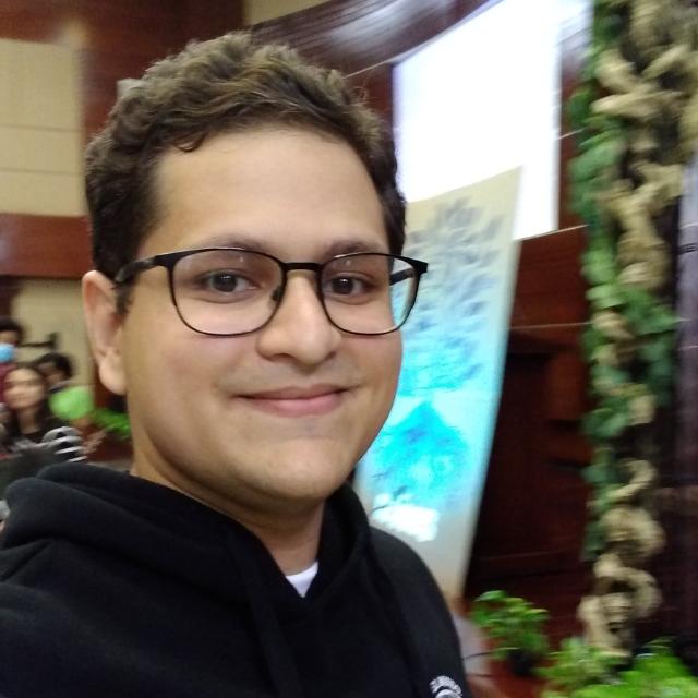 Raul facing toward the camera, wearing a black hoodie